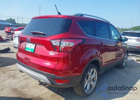 2018 Ford Escape Titanium z USA, uszkodzony, nr VIN 1FMCU9J9XJUB20994